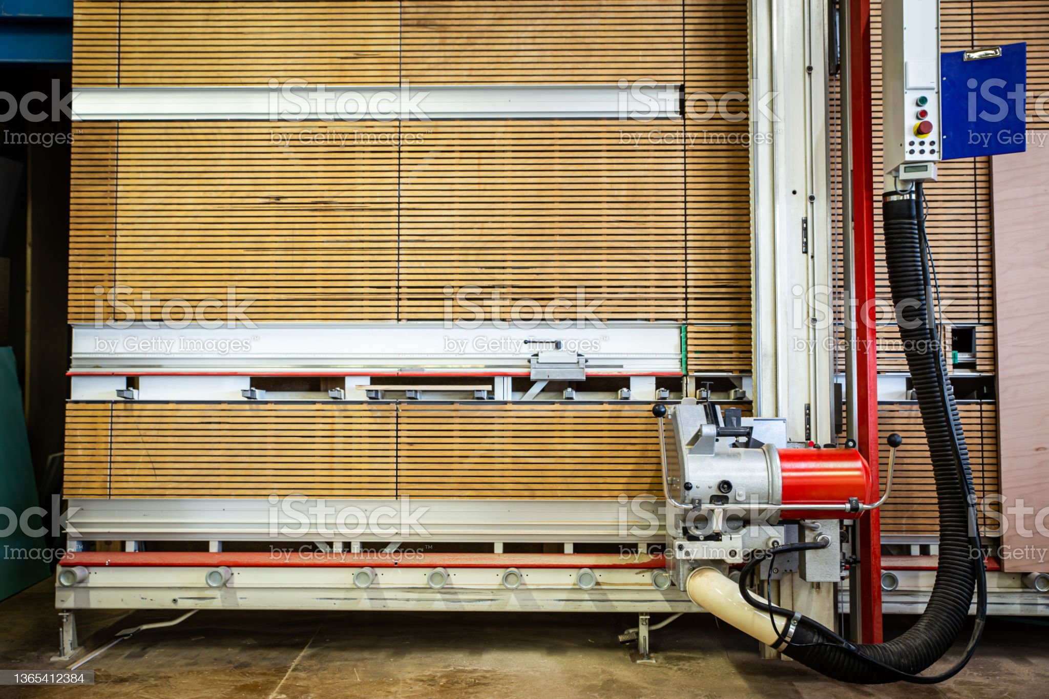 a vertical panel saw in a carpenter's shop or a hardware store, a vertical circular saw in a workshop